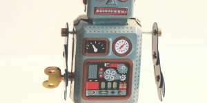 A close-up of a humanoid robot face, representing the uncanny valley and the need for vibe auditing.