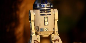 A humanoid robot in an office setting representing AI replacement