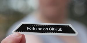 A humanoid robot and a human hand in an emotional interaction