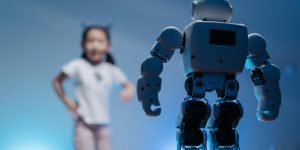 A sleek white humanoid robot standing in front of a girl, representing social interaction and personal styling.