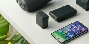 A technician performing maintenance on a complex robotic arm in an industrial setting.