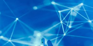 Humanoid robot and human collaborating in a modern office 2026