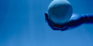 Human and humanoid robot working side-by-side in a modern office