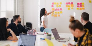 A human leader inspiring a team in a collaborative office setting