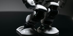 A human interacting with a humanoid robot in a laboratory setting, representing the ground truth verification.