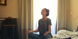 A professional man meditating in a modern office, representing the Strategic Silence Consultant career.